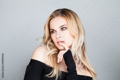 Thinking Woman with Blonde Hair. Young Female Model Face