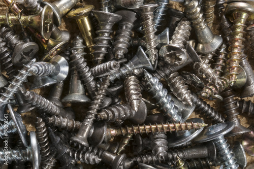 Pile of loose assorted sizes screws. Macro of pile of screws