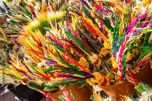 Traditional easter palms sold on market square in Krakow (Poland)