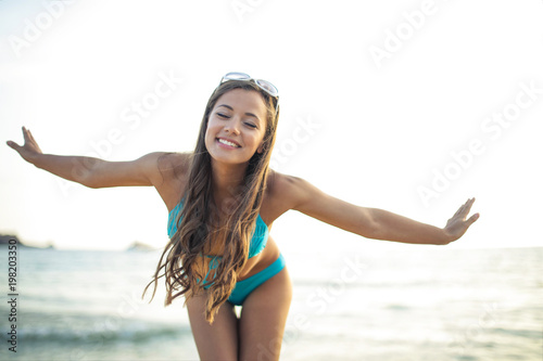 Beautiful young woman at the seaside