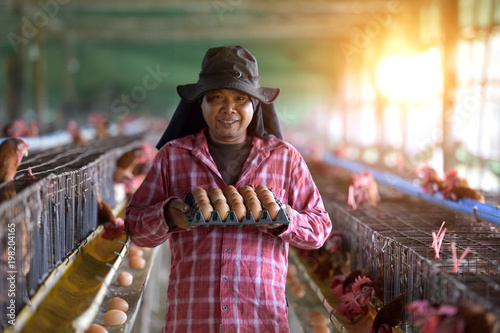 Farmer holding fresh organic eggs