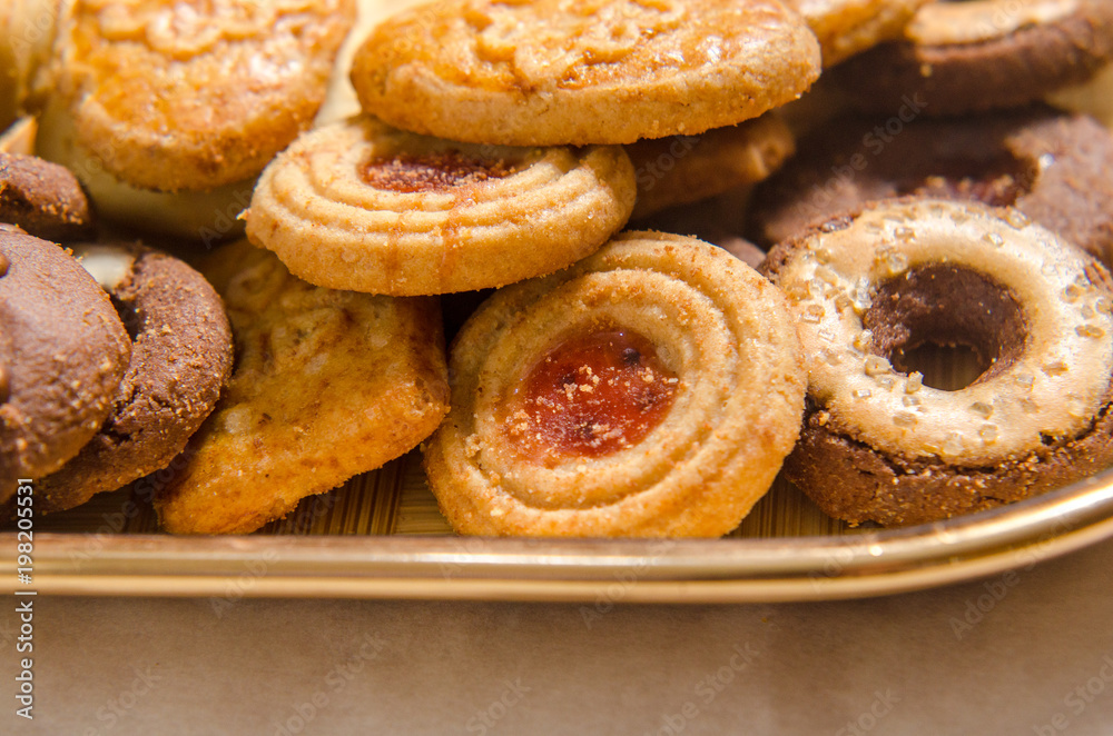 assorted cookies on wooden tray