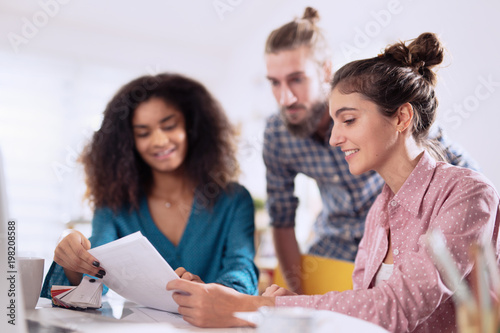 Multiracial business team working together around a laptop  