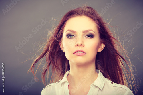 Attractive brunette woman with windblown hair