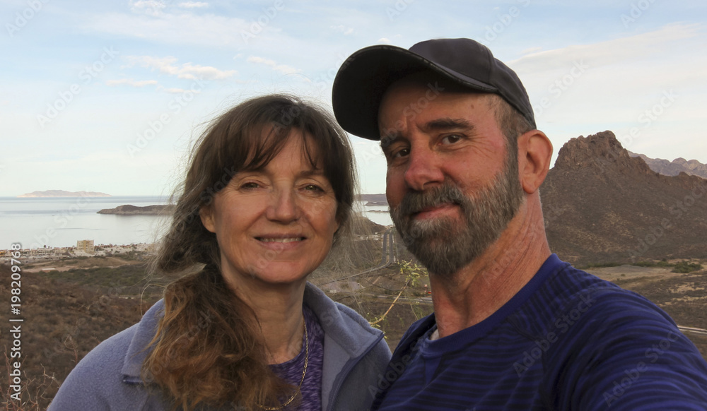 A Hiking Couple Takes a Selfie on Tetakawi Mountain Above Los Algodones A Hiking Couple Takes a Selfie on Tetakawi Mountain Above Los Algodones