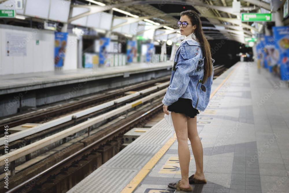 Sexy model is posing on the railway platform