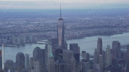 New York City aerial view of Lower Manhattan Financial district skyscrapers, One World Trade Center, the Hudson River and Jersey City.