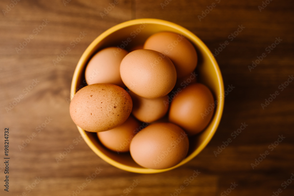 Farm Fresh Brown Eggs in a Yellow Bowl Farm Fresh Brown Eggs in a Yellow Bowl