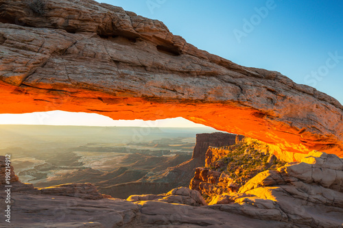 Beautiful Canyonlands view, from Mesa Arch, under warm surise light, on a clear autumn day © Calin Tatu