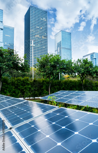solar panel plant with urban landscape landmarks,Ecological energy renewable concept.