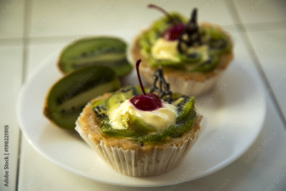 Delicious fruit cake with curd cream with kiwi and cherry Delicious fruit cake with curd cream with kiwi and cherry
