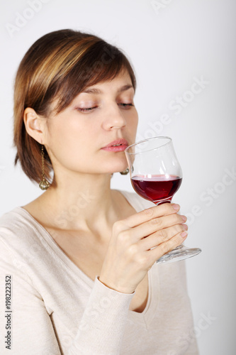 A woman tasting pink wine