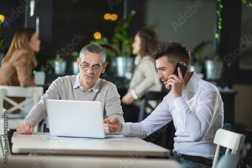 Businessmen having meeting in a restaurant