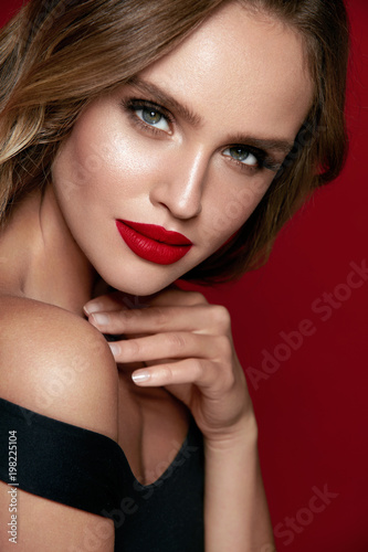 Beautiful Woman Face With Makeup And Red Lips.