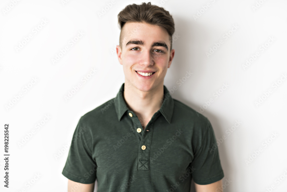 portrait of young smiling cute teenager in white wall portrait of young smiling cute teenager in white wall
