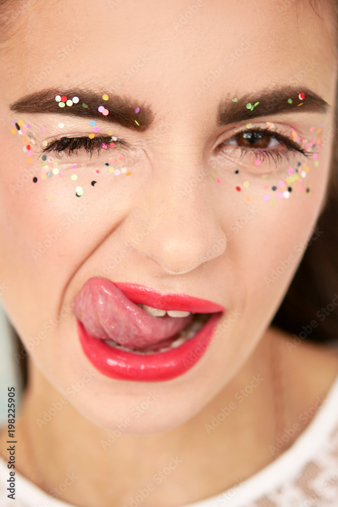 Fashion photography. Portrait. Red lipstick and lip gloss