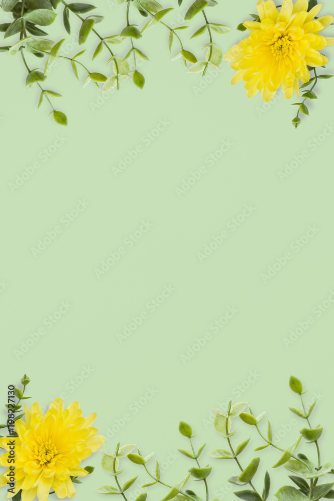 Wedding invitation or card with abstract floral background. Yellow chrysanthemums and green twigs on a green background.