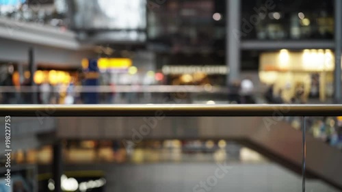 Blurred view of people walking inside of transportation hub. Concept of travelling and sightseeing. Locked down real time medium shot