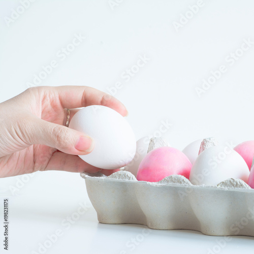 Woman's hand holding Easter egg. Easter composition