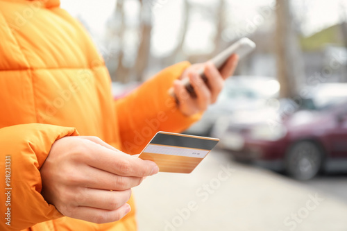 Woman with credit card and ...
