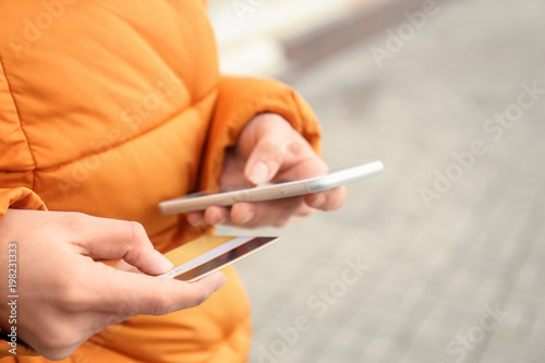 Woman with credit card and ...
