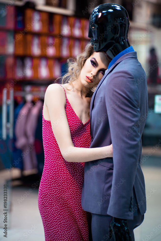 Fototapeta premium Woman hugging mannequin