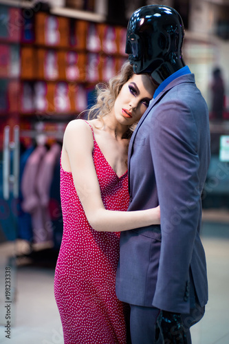 Woman hugging mannequin