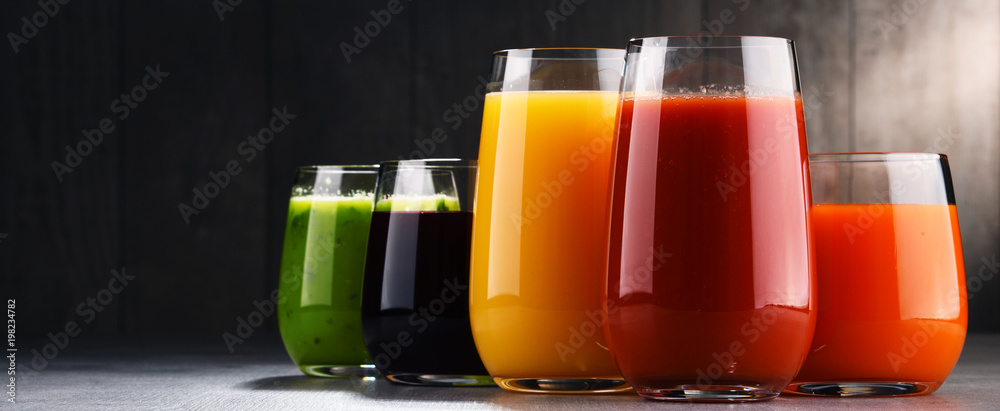 Glasses with fresh organic vegetable and fruit juices Glasses with fresh organic vegetable and fruit juices