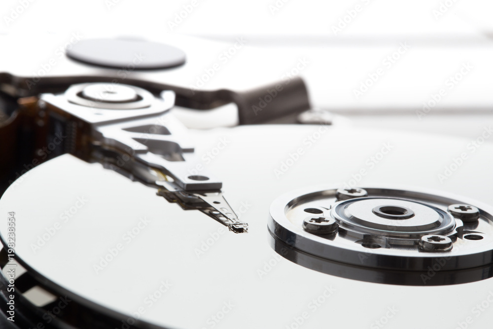Computer hard disk - interior with visible plate and laser Computer hard disk - interior with visible plate and laser