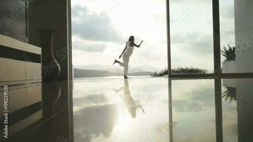 Woman practicing yoga Nataradjasana and Hasta Uttanasana. Yoga lifestyle concept photo