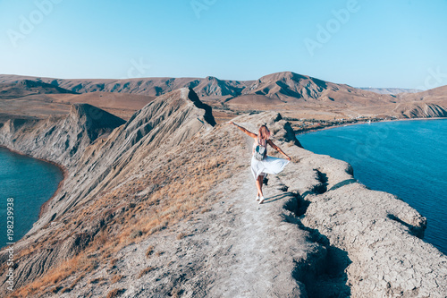 Girl walking on the mountain top