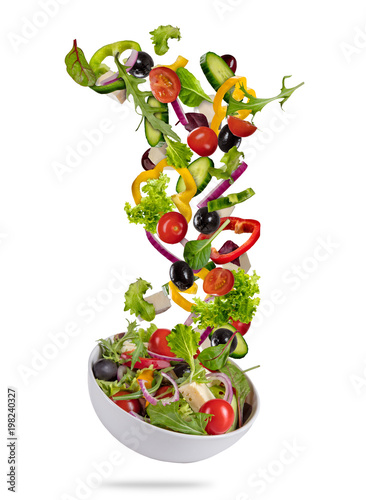 Flying vegetable greek salad isolated on white background