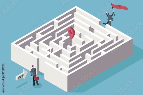 Business Man Standing in Front of a Maze