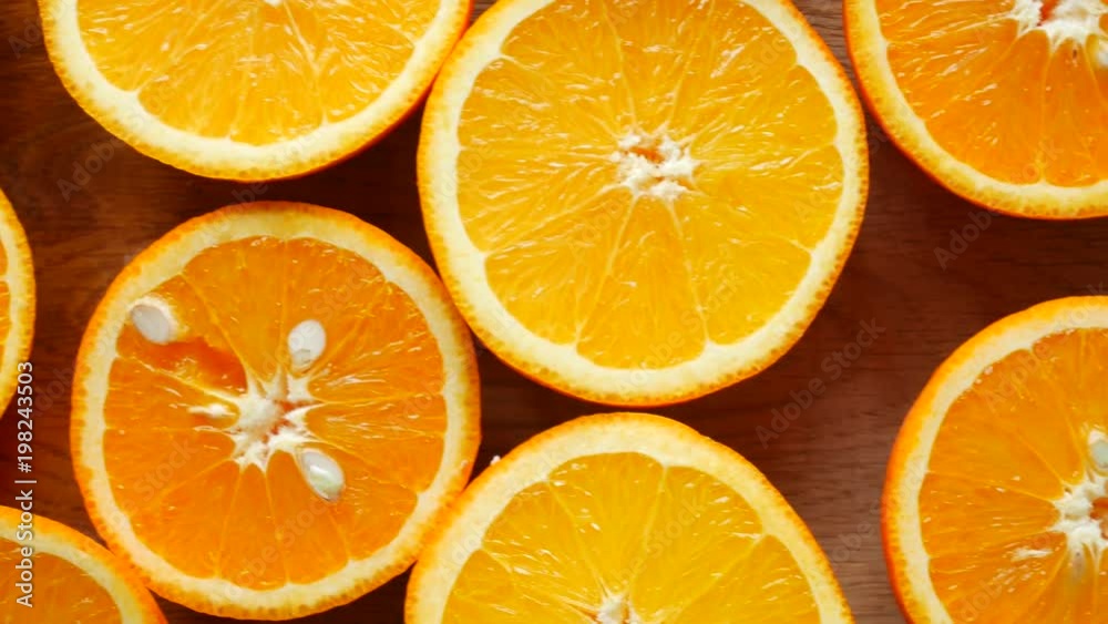 Dolly shot of orange halves lay on the table Dolly shot of orange halves lay on the table