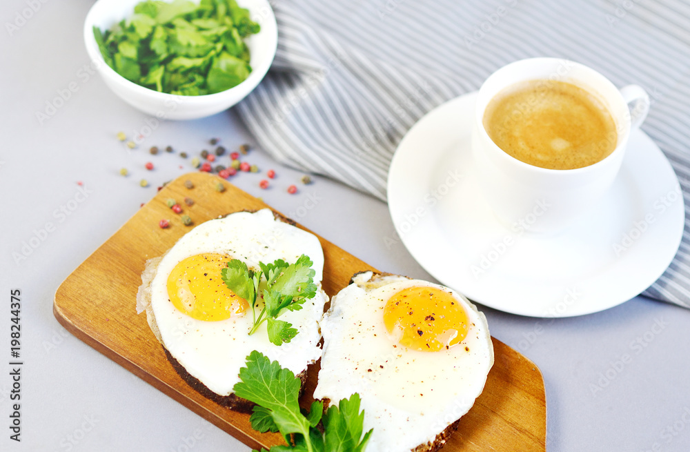 Fototapeta premium Morning Coffee White Cup Beverage Orange Juice Sandwich with Tasty Fried Egg Served on a Wooden Tray Parsley Pepper Tomato Cherry Grey Background Healthy Food Concept Vegetarian Modern Lifestyle