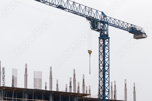 Crane and building under co...