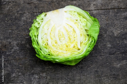 
Cut cabbage cabbage on a wooden surface.