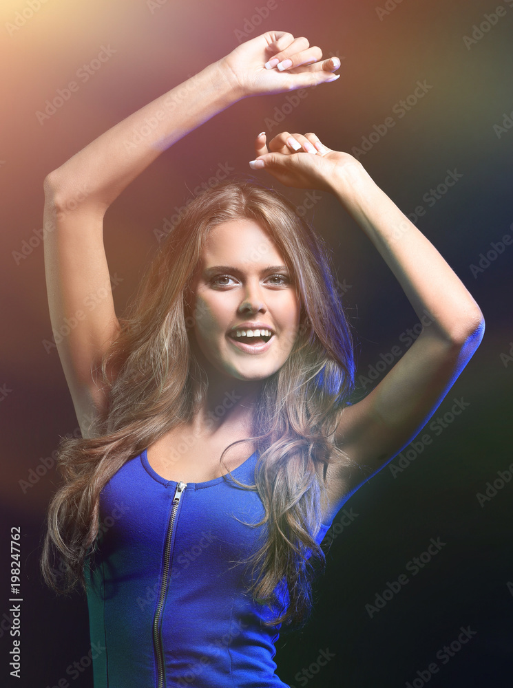 portrait of a dancing woman in a short dress, black background portrait of a dancing woman in a short dress, black background