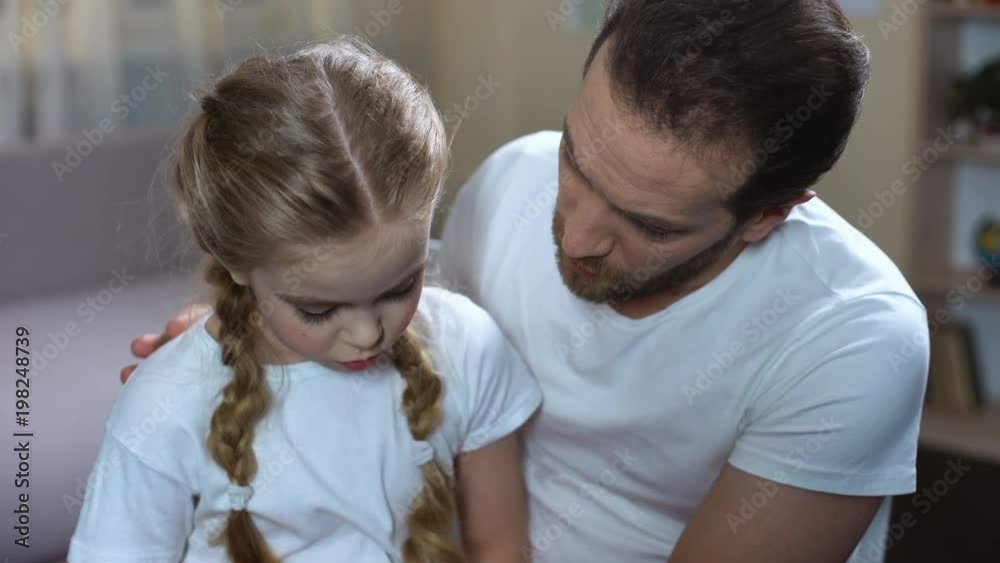 Loving father talking with daughter, parent support, spending time together Loving father talking with daughter, parent support, spending time together