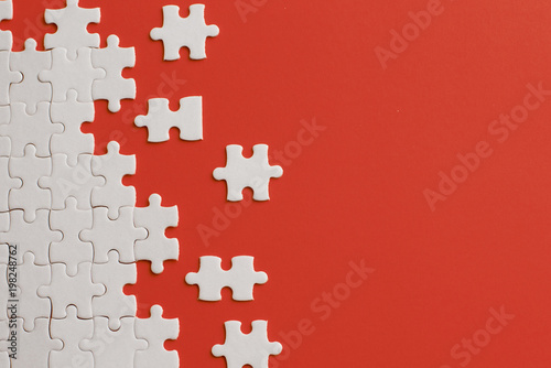 White details of puzzle on red background