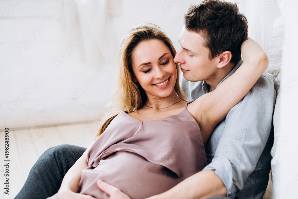 Photo of a happy beautiful couple who is waiting for the birth of their baby Photo of a happy beautiful couple who is waiting for the birth of their baby