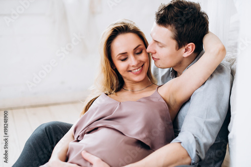 Photo of a happy beautiful couple who is waiting for the birth of their baby