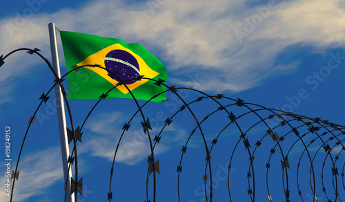 3D illustration of a Brazilian flag waving on a flagpole with razor wire in the foreground; depicting security and barriers between nations. 