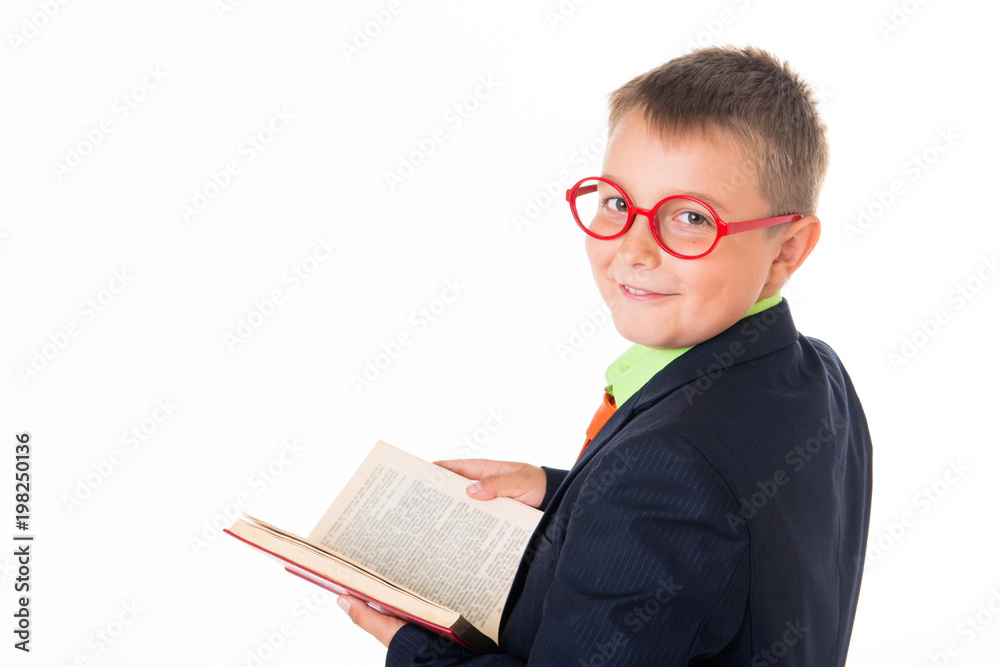 Boy reading a book thirsty for knowledge - isolated over a white background Boy reading a book thirsty for knowledge - isolated over a white background