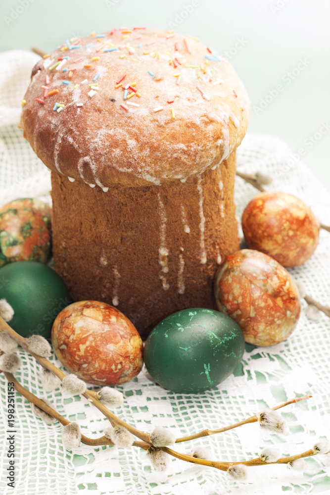 Studio photo of Easter cake with dyed eggs