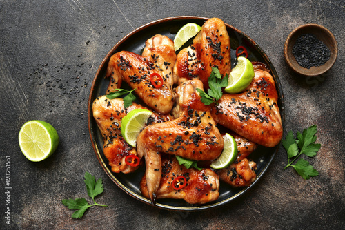 Stampa su Tela Grilled teriyaki chicken wings with black sesame and lime