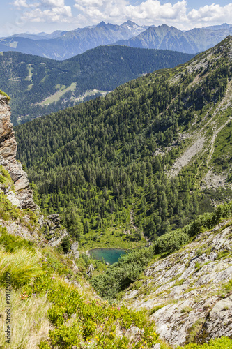 View from mountain Rippetegg to lake Schobersee and Schladminger Tauern photo