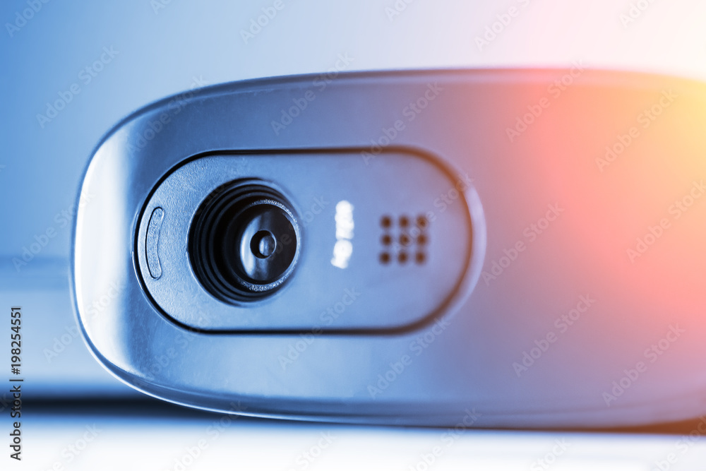 Modern web camera, close up, blue toned Modern web camera, close up, blue toned