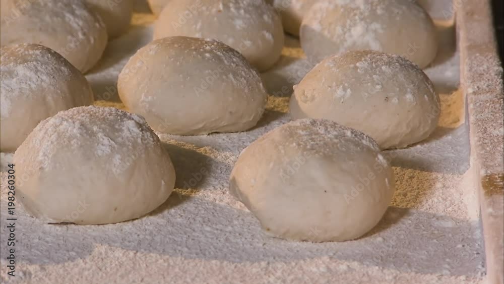 A pan to left close up shot of flour and dough, A pan to left close up shot of flour and dough,