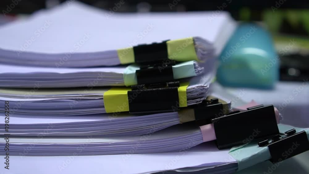 Businessman searching documents files or information in Stack of papers folder on work in office, Business report paper or piles of unfinished document achieves with clips on offices, Business concept Businessman searching documents files or information in Stack of papers folder on work in office, Business report paper or piles of unfinished document achieves with clips on offices, Business concept